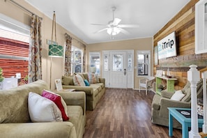 The natural light filled living room is open and spacious.