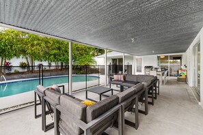 Enjoy serene moments on the patio just steps from the sparkling pool.