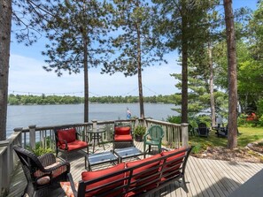 lakeside deck with amply seating to enjoy sweeping lake views