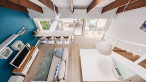 Another view of the living room, downstairs dining area