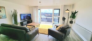 Lounge with double doors leading to rear balcony