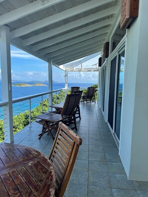 Upstairs porch with ample seating to soak in the views.