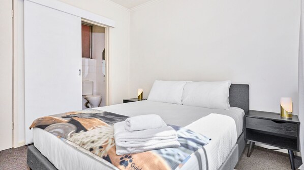 A comfortable queen bed is provided for your stay