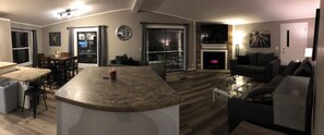 Panoramic view of dining, island, and living room