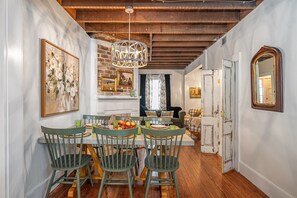 Share a meal in this beautifully appointed dining room, featuring historic touches and modern comfort.