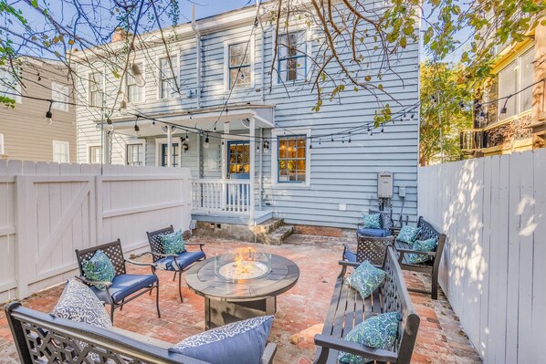 The courtyard is accessible from the gate to the parking area or the shared porch.