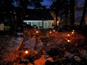 A warm and inviting well-lit entrance to our cottage for your romantic stay!