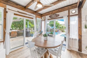 Bright and sunny extended dining space with access to the back deck