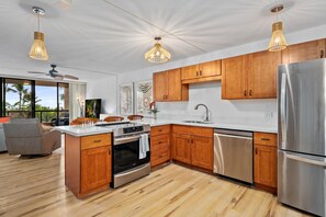 Fully equipped kitchen with stainless steel appliances & granite countertops