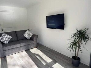 Bright living room french doors onto garden