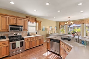 This open kitchen has enough room for the whole family to gather and visit while prepping dinner.