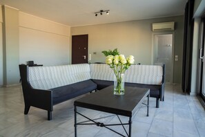 Lily's Penthouse-Living room area with corner sofa , dining table for 6 people