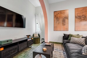 Cozy living area with a large-screen TV, perfect for movie nights and relaxing evenings