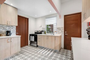 Contemporary kitchen with a cozy charm, perfect for preparing and sharing meals.
