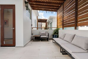 Relax in this stylish outdoor lounge, perfect for enjoying sunsets and fresh air.