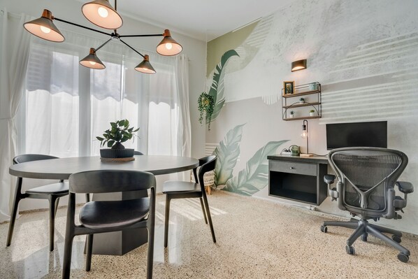 Stay productive in this inviting workspace featuring a wood table and a calm, focused atmosphere.