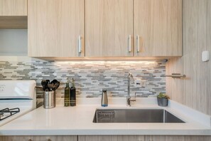 A sleek, minimalist kitchen equipped with everything you need to feel right at home.