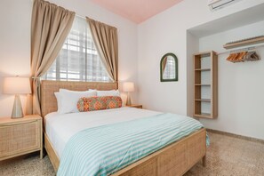 Simplicity at its finest – unwind in this serene, minimalist bedroom.