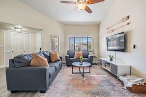 Relax in the inviting living room with plush sofas, a 55” Smart TV featuring YouTube TV and a sports package, and a variety of board games. This spacious area is perfect for family movie nights, game time, or unwinding after a day of adventure.