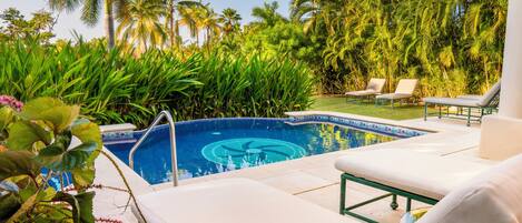 Unwind by the pool and soak up the sun on the lounge chairs.