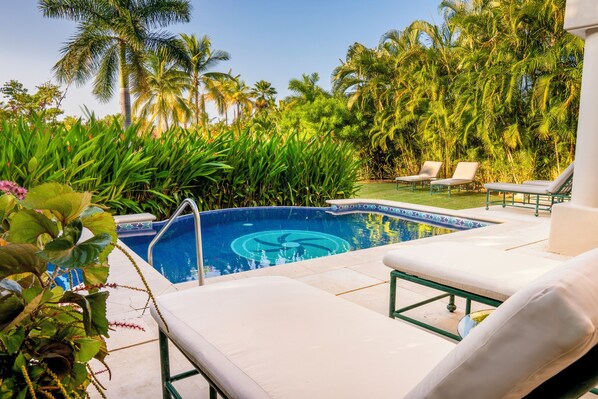 Unwind by the pool and soak up the sun on the  lounge chairs.