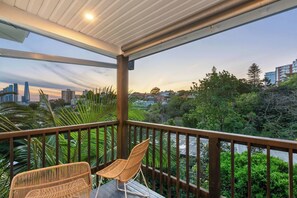 Watch as the sky changes hue overhead from your private balcony, overlooking the city.
