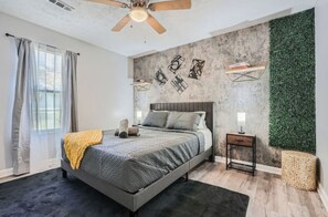 Bedroom 2: A tastefully designed bedroom with a comfy queen bed.

