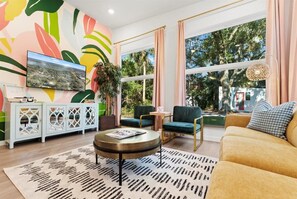 Vibrant and Spacious Living Room: A cozy retreat that’s perfect for family gatherings or relaxing with friends.