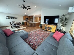 Spacious living room with 80 inch HDTV