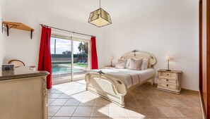 This sunlit bedroom combines timeless elegance with tranquil garden views for the ultimate retreat. #TimelessCharm #CozyEscape