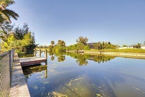 Private Dock | Canal View | Heated Pool | Screened Lanai | Fenced Yard