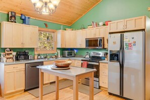 Prepare delicious meals in this fully equipped kitchen, complete with all the essential appliances for your convenience.