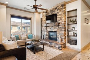 Living room with a SmartTV and cozy fireplace