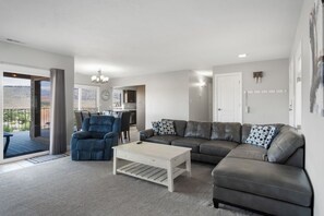 Cozy and spacious living area with TV and fireplace