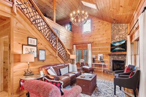 Enjoy a gas log fireplace while relaxing in the  living room. 