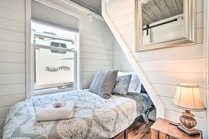 Cozy nook bedroom with soft linens and warm lighting—your own private hideaway for peaceful nights.