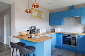 The fully equipped kitchen has all the modern amenities you need to prepare meals for family and friends.