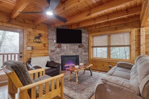 Living room features a fireplace and a TV.