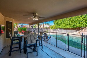 Covered patio with two outdoor dining areas.
