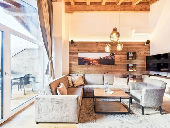 Furniture, Interior Design, Flooring, Couch, Wood, Floor, Wood Flooring, Living Room, Ceiling, Lighting
