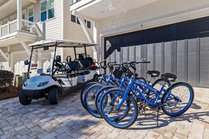Cruise around the neighborhood on the provided golf cart of beach cruiser bikes!
