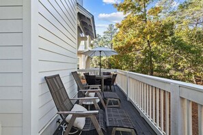 A peaceful outdoor lounge area with comfortable chairs and a scenic view.