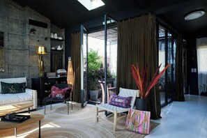 The living room and the access to the patio.