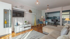 Bright and inviting living room with a comfortable sofa, perfect for relaxing after a day of exploring. Modern decor and ample space create a cozy and stylish atmosphere. #cozy #living