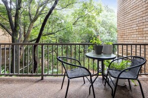 Enjoy your morning cuppa or an afternoon glass of wine on the leafy private balcony.