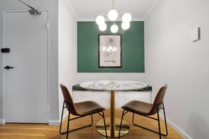 Enjoy meals in the elegantly appointed dining nook, offering a four-seater table, with additional seating at the breakfast bar.