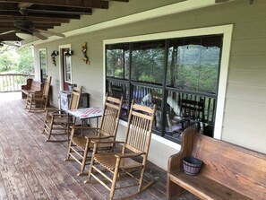 A glass of wine, a rocking chair, and sweet mountain breezes all await you on the shaded country porch!