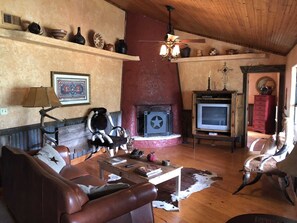 The authentic Kiva fireplace adds flickering accents and warmth on those cool Hill Country nights.