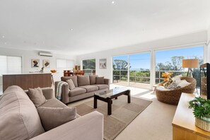 Upstairs open plan lounge/dining/kitchen with Bay Views from the balcony. Split system air-conditioning cooling & heating.Upstairs open plan lounge/dining/kitchen with Bay Views from the balcony.