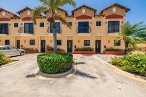 Discover your new home sweet home! These vibrant townhomes are nestled in a tropical paradise, complete with beautiful landscaping and sunny vibes!